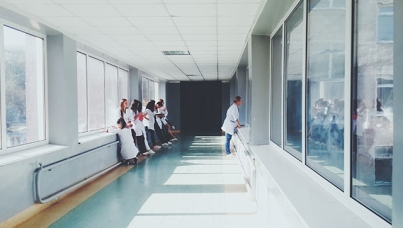 Doctors looking through observation window