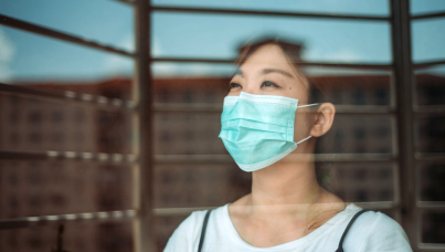 woman looking out window 
