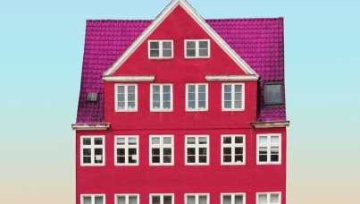 pink house front against a blue sky
