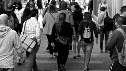 people walking through a crowded street