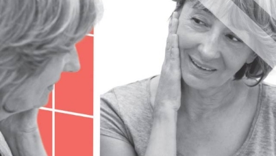 older woman looking into a mirror