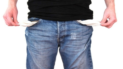 Man with hands in empty pockets