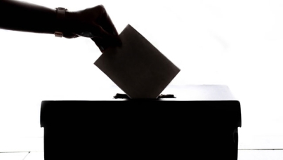 placing-ballot-in-box-black-and-white