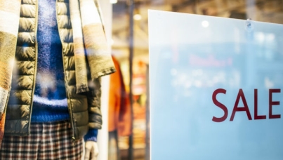 Sale sign in clothing store window