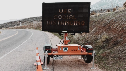 Highway sign encouraging people to socially distance