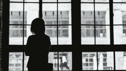 Image of woman staring out of window