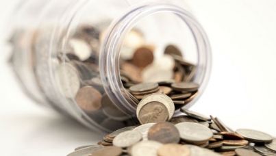 Image of jar of spilled coins