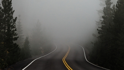 Road leading into fog