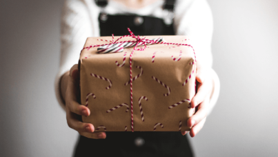 Person holding wrapped gift