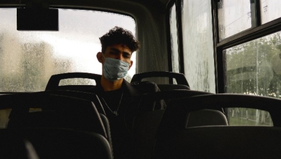 Man on bus wearing mask