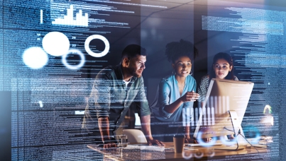 group of business people discussing something on a monitor