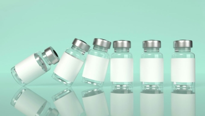 vaccine bottles falling like dominos