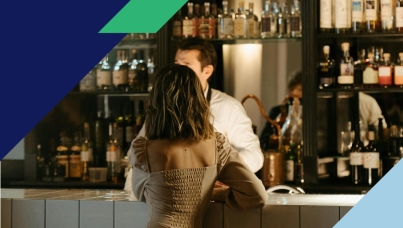 Woman orders a drink at a bar