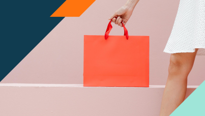 Woman holding an orange shopping bag