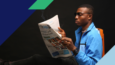 Image of a man reading a newspaper