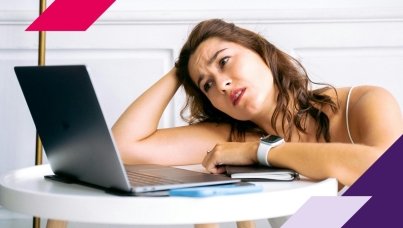 Woman staring at computer screen in frustration
