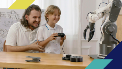 Man and son controlling a robotic arm