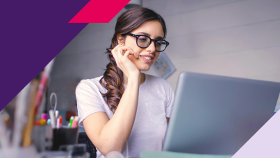 Woman using computer and smiling