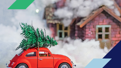 Toy car carrying a toy christmas tree