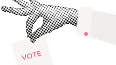 A hand casting a ballot into a box