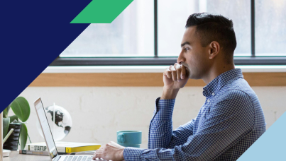 Picture of a man thinking while looking at a computer