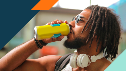 Photograph of man drinking from a brightly colored can