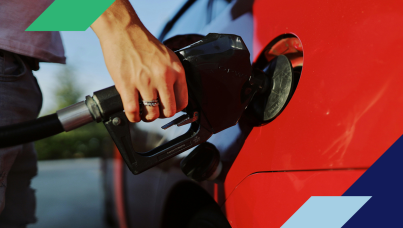 Photo of a person pumping gasoline