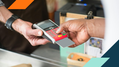 Photo of a person paying with a credit card at a retail store