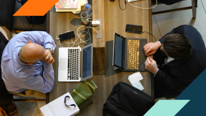 Image of two people using computers