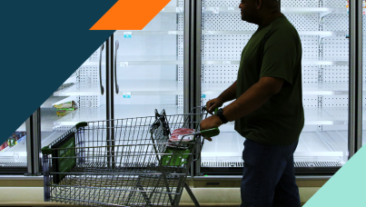 Image of a man pushing a shopping cart 