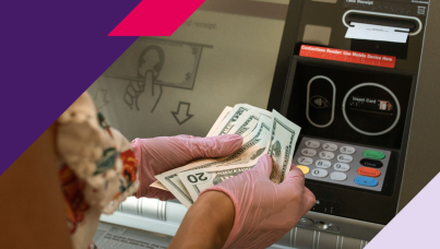 Image of woman taking cash out of an ATM