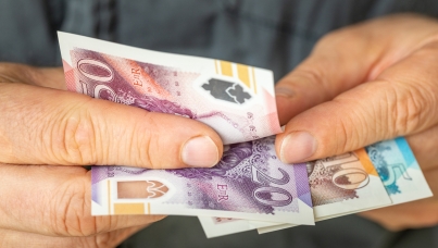 A person counts cash