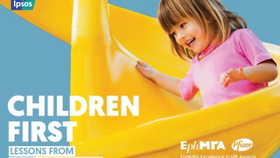 Child going down a yellow slide
