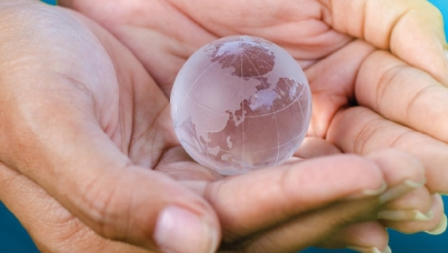 hands holding globe