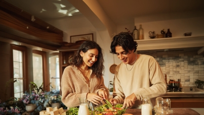 a happy Gen Z couple sorting out food items