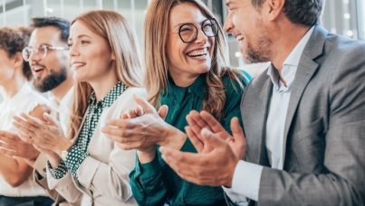 A few people laugh and clap hands