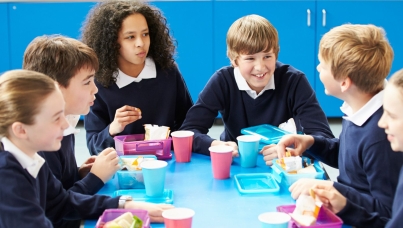 Kids are having a breakfast at school