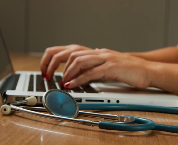 GP using laptop