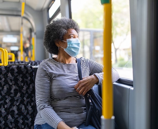 Womens Forum Barometer | Woman on bus wearing mask | Ipsos 2021