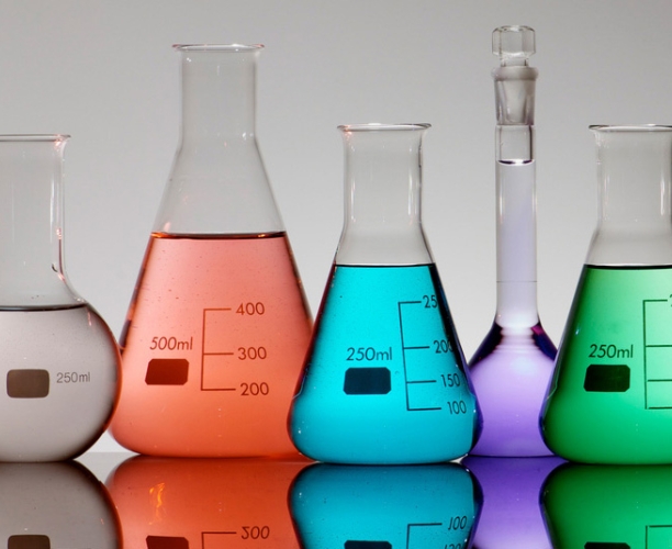 lab glassware filled with different colour liquids to suggest a wide range of research
