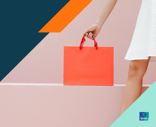 Woman holding an orange shopping bag