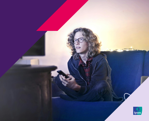 Image of a person watching TV while sitting on a couch