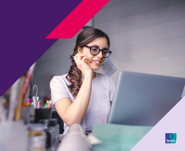 Woman using computer and smiling