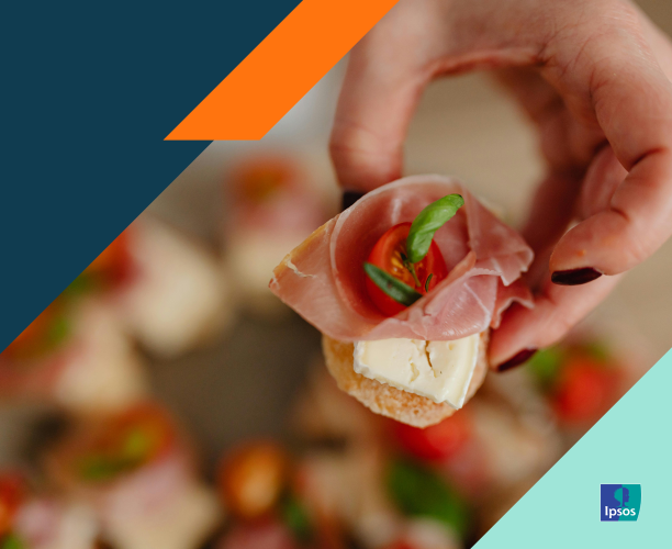 Hand holding a small, healthy snack