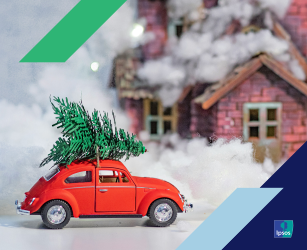 Toy car carrying a toy christmas tree