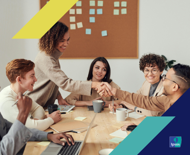 Image of people shaking hands in a board room