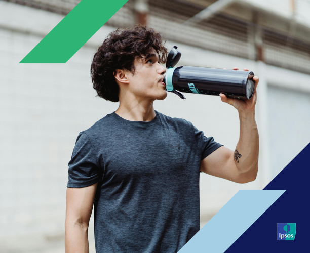 Image of man drinking from a metal bottle