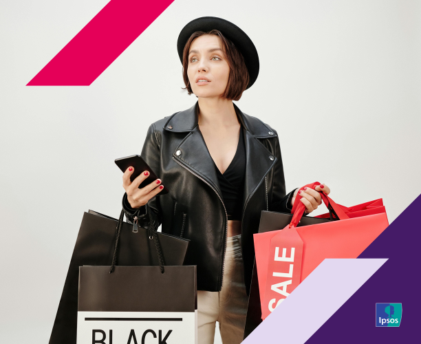 Image of woman shopping while holding a phone