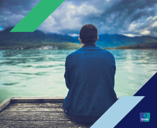 Photo of man staring out onto water