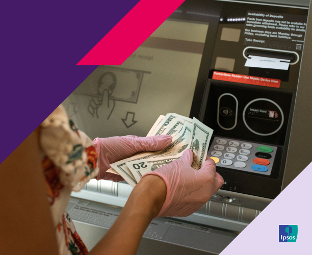 Image of woman taking cash out of an ATM